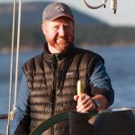 Capt. Kevin Smith at the helm of heritage Canadian schooner Maple Leaf in BC. Photo by Greg Shea.