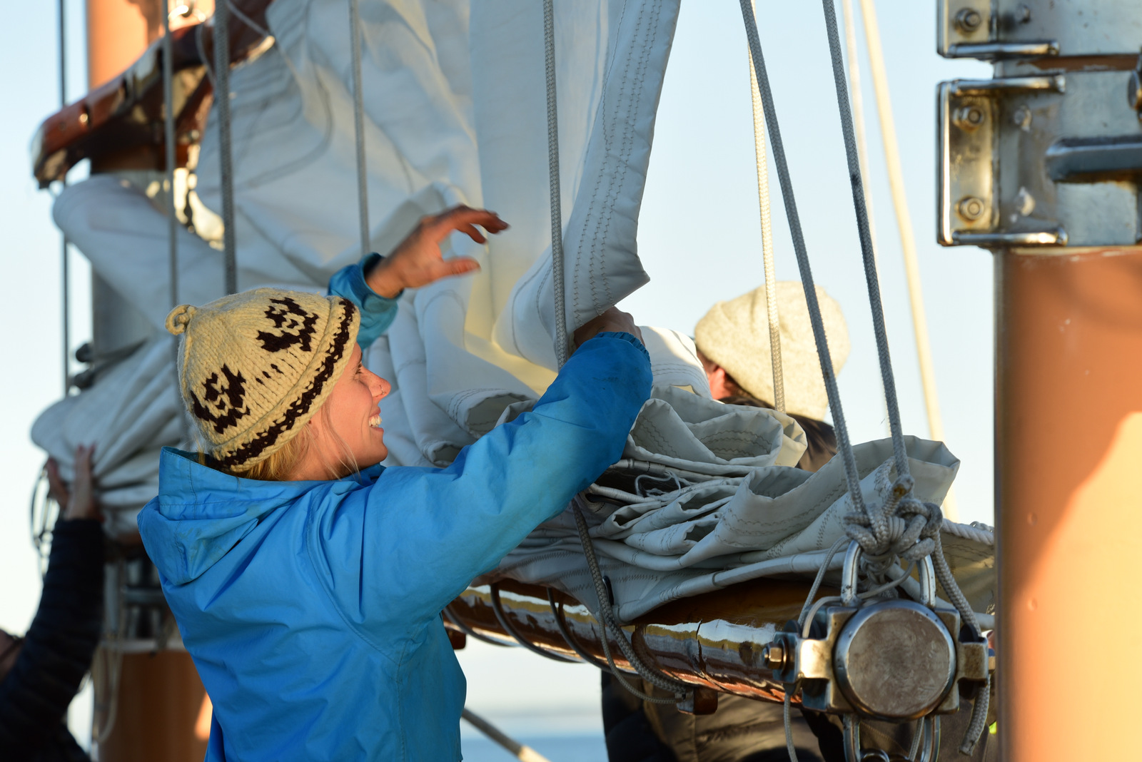 Guest helps with sails aboard Maple Leaf