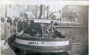 Swell in the 1920s in Victoria, BC, Inner Harbour. The man on the stern is Ivan H Clarke. We have this photo courtesy of Michael Kaehn, Ivan's grandson. Ivan was the youngest person on the coast then to obtain his Master's certificate on the west coast. He was 21.