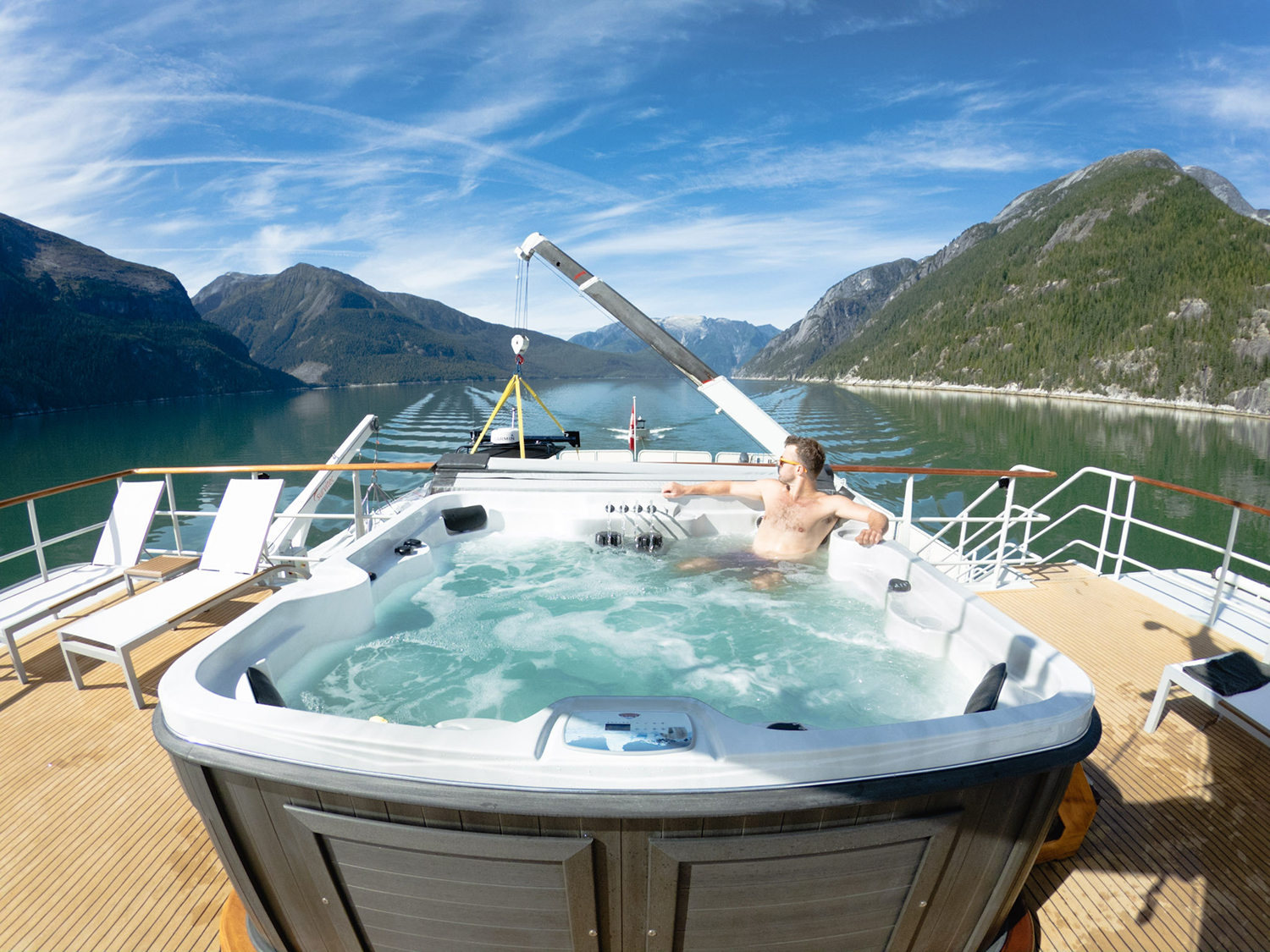 Apres ski soak in the top deck hot tub with a 360-degree view of the Coast Mountain fjords.