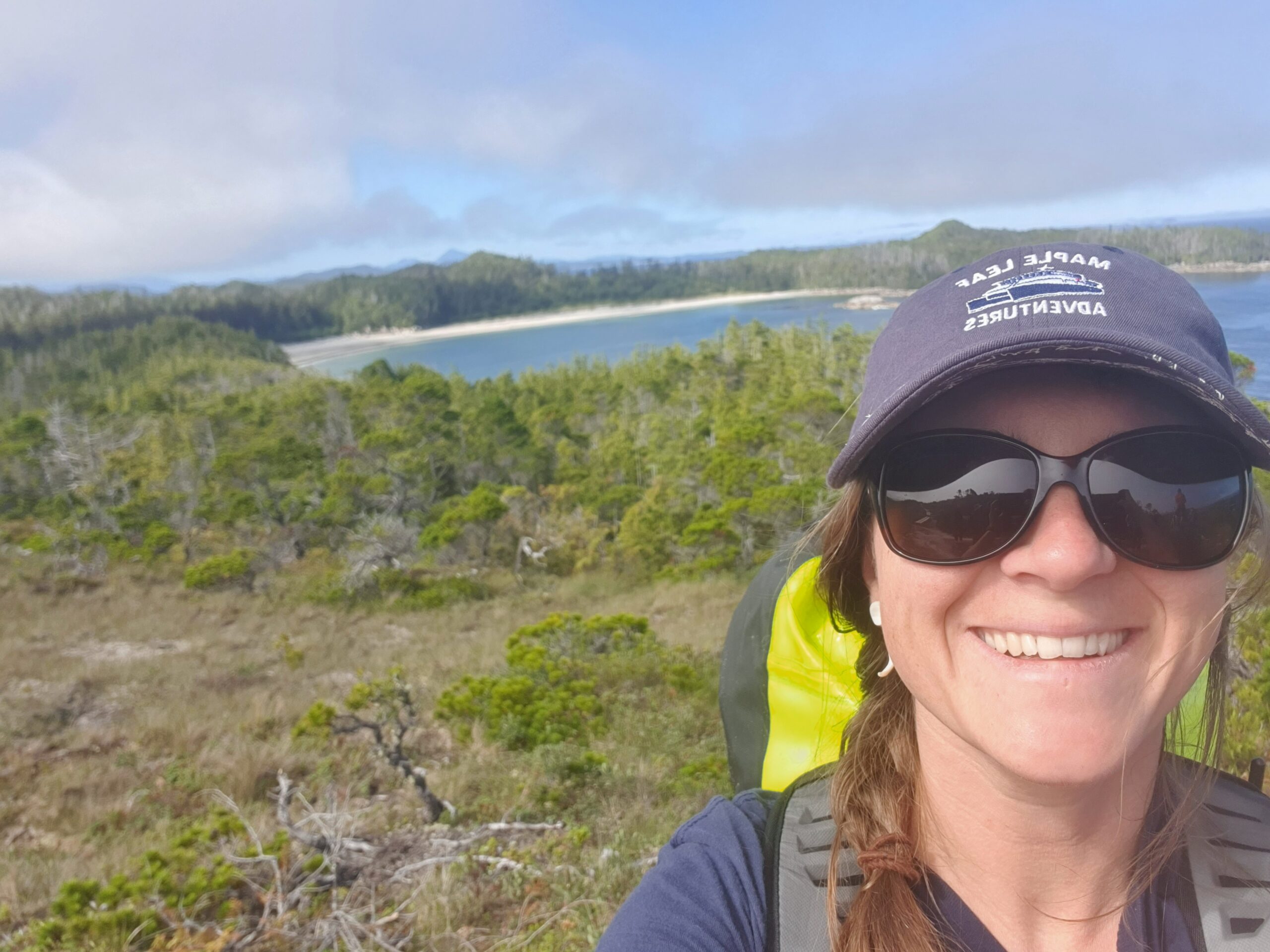 Carrie Poborsa-Cox, smiling and looking ready for adventure aboard a Maple Leaf Adventures vessel.