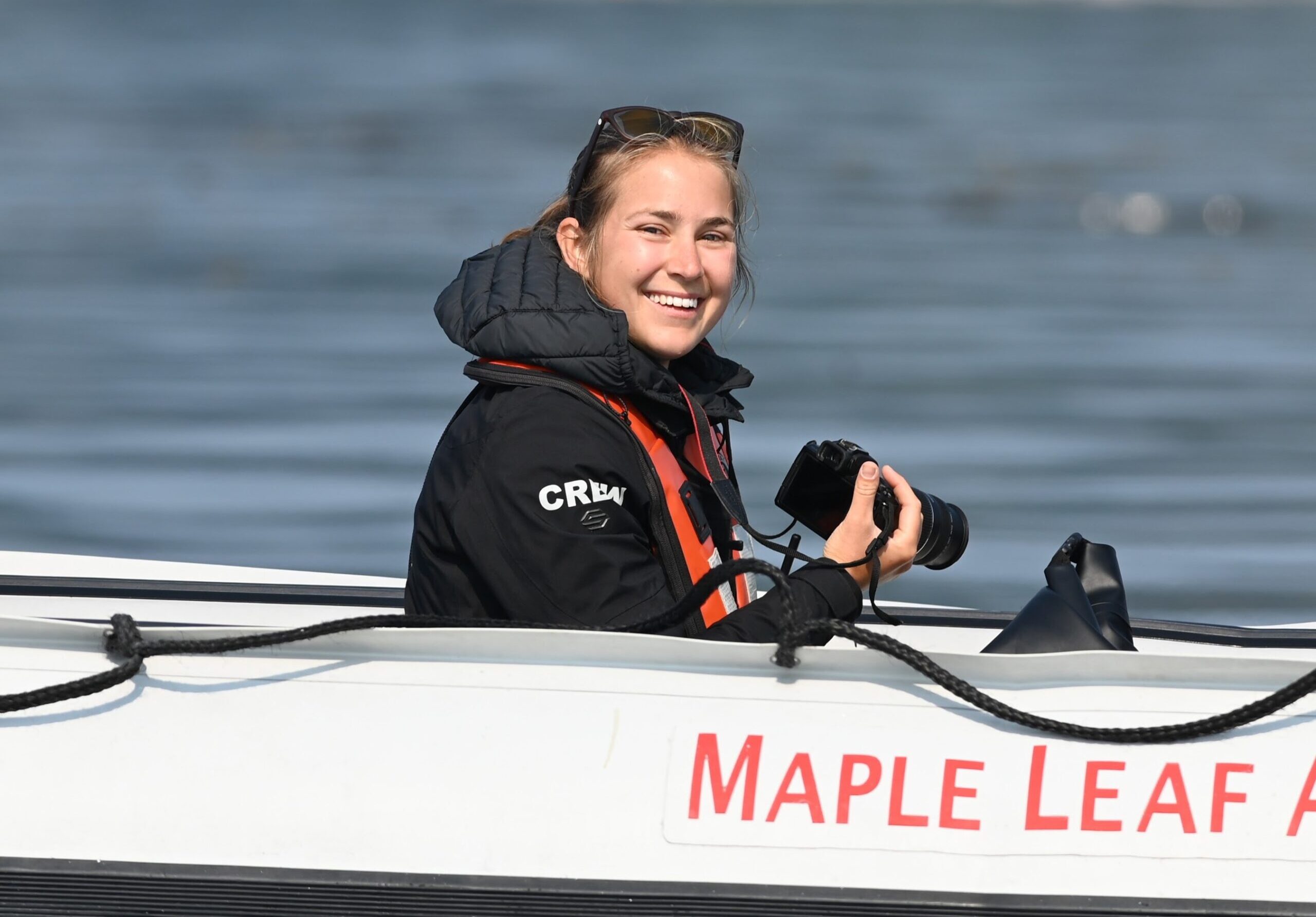 Emma Troost, smiling, representing her role in Maple Leaf Adventures.